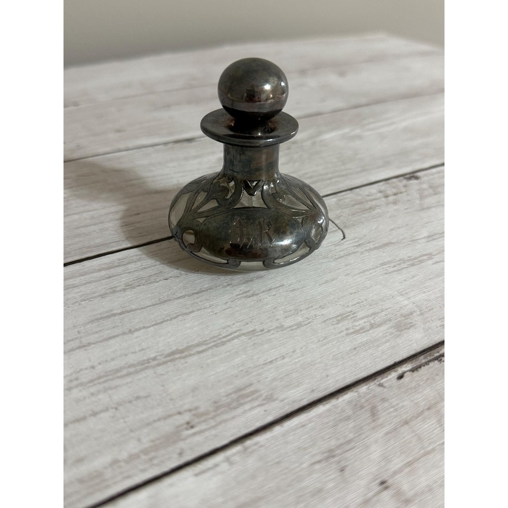 Art Nouveau silver overlay glass perfume bottle with monogram.